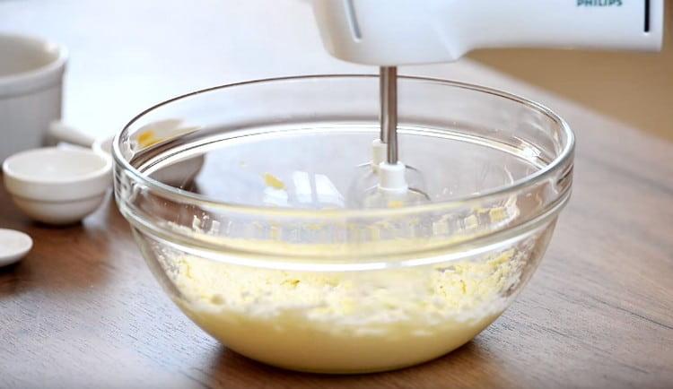 Beat butter with sugar with mixer.