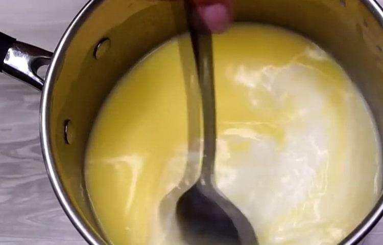 Fügen Sie Butter hinzu, um Käsekuchen im Ofen zu machen
