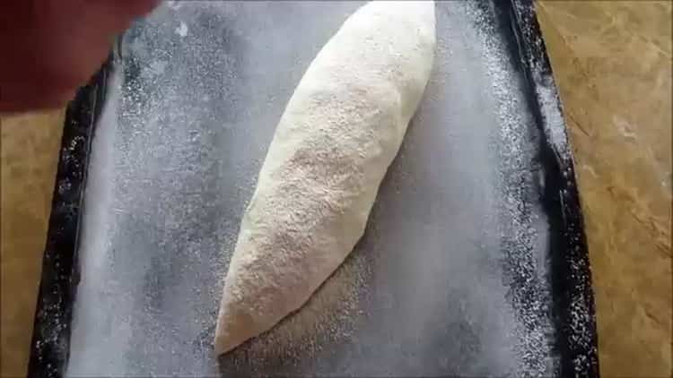 طبقًا للوصفة ، لطهي الخبز الأبيض في الفرن ، سخن الفرن