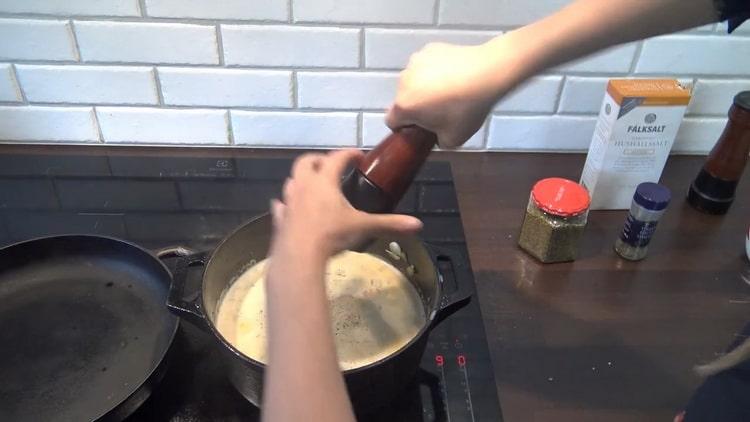 Aggiungi il pepe per preparare la zuppa di merluzzo